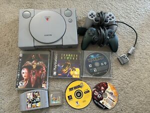 Mixed gaming Lot Ps1 console (super clean) and  (7) mixed games