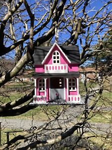 Red decorative wooden hand painted bird house