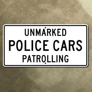 North Carolina unmarked police cars patrolling highway marker road sign 24x12