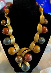 Unusual vintage necklace, chunky beads and gold tone metal leaves