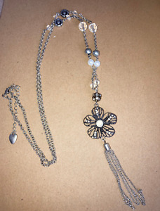 Silver tone long necklace with floral pendant and chain tassel - free shipping