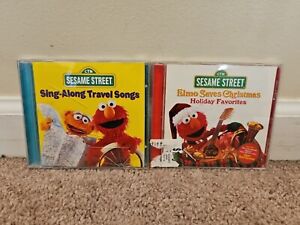 Lot of 2 Sesame Street CDs: Sing-Along Travel Songs, Elmo Saves Christmas
