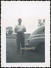 New ListingVINTAGE PHOTO HANDSOME HUNK MAN HOLDING a BOUQUET of FLOWERS by a CAR
