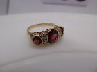 9 Ct Gold Ring with Garnet Trilogy Surrounded By 4 Genuine Diamonds hallmarked