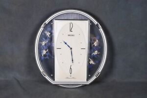 Seiko QXM158SRH Melodies In Motion Crystal Pendulums Wall Clock Silver & Blue