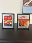 Atari 2600 Video Game Lot: Dig Dug & Raiders Of The Lost Ark
