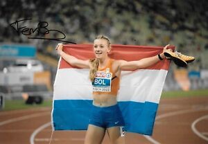 femke bol olds her netherlands flag after winning the race signed 12x8 photo