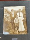 Antique Photo Of A Family With Their Dog**