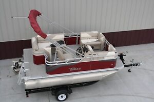 New 15 ft  pontoon boat with 25 hp four stroke Tohatsu and trailer