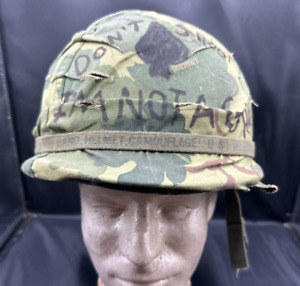 Post Vietnam War US M-1 helmet with camo cover, liner, and helmet band