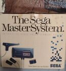 The Sega Master System. Complete. With Two Game And Light Phasher. Tested Works.