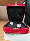 Authentic Cartier cufflinks with box and certificate. Wax seal motif, silver.