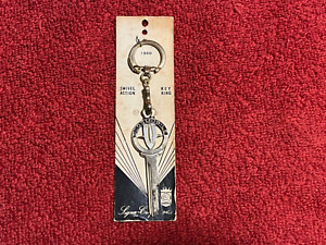 New ListingNOS OLDSMOBILE CREST LOGO KEY BLANK WITH CHAIN RING 1960's 1970's GOLD TONE