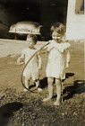 New ListingLittle Girl Drinking From Water Hose With Boy In Yard B&W Photograph 3.25 x 4.5