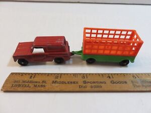 Vintage diecast and plastic Tootsie Toy Panel Truck with trailer and cargo cage