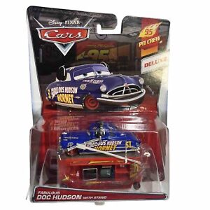 DISNEY PIXAR CARS 2014 DELUXE 95 PIT CREW FABULOUS DOC HUDSON WITH STAND NEW
