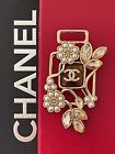 Floral design chanel bottle brooch with cc logo gold amber gem and pearls