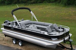 New 25  ft. pontoon boat with 115 Hp Mercury and dual bunk trailer