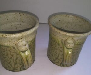 2 pottery mugs by Artist &Signed Larry Riffle, speckled glaze  green/ browns