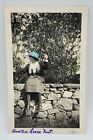 Caption ANOTHER LOOSE NUT~Vtg HAND TINTED Photo~Woman Sitting Rock Wall~May 1922
