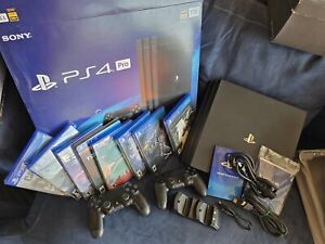 New ListingPlaystation 4 Pro 1TB Console W/2 Controllers, Desk Charger, And 8  Games