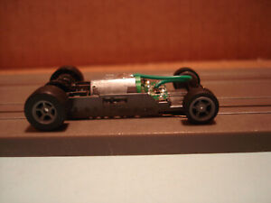 AFX RACING H.O. SCALE MEGA G+ 1.7 NARROW CHASSIS WITH GRAY 5 SPOKE RIMS