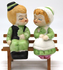 Kissing Irish boy and girl couple on bench salt and pepper shaker